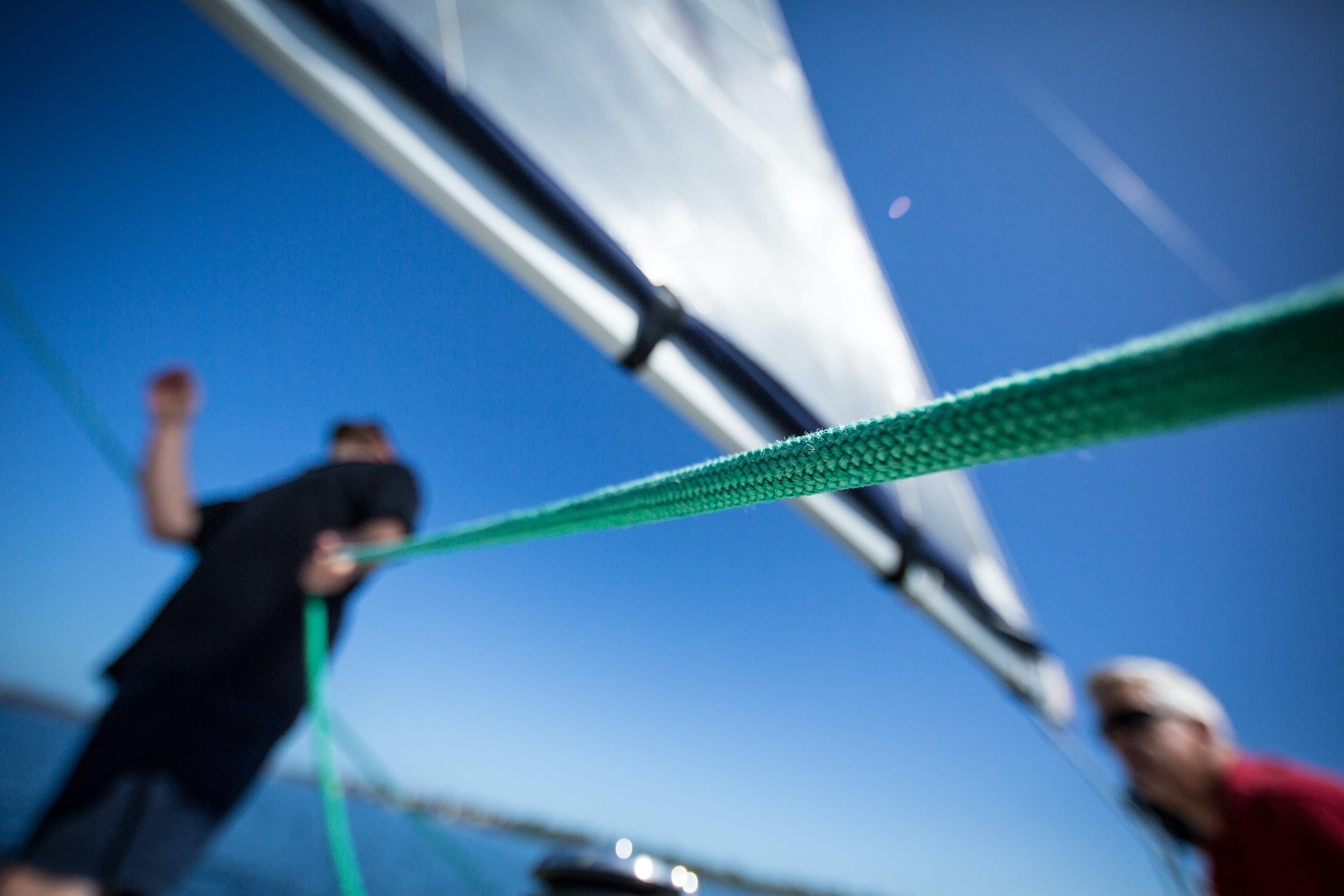 man in a boat holding a rope explained in our Glossary of Nautical Terms