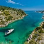 picture of a yacht in a greek inlet