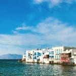 white houses on the coastline in Mykonos