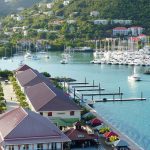 harbour in the BVI with buildings and boats on a British Virgin Islands catamaran charter