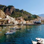 Amalfi coast with boats and mountains on a Europe yacht charter with skipper