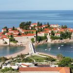 island with orange roofed houses and ocean in Montenegro on a europe bareboat charter