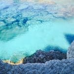 clear waters and cliffs on a mediterranean bareboat charter