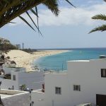 white houses, the beach and ocean on a canaries bareboat charter