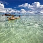 a canoe in the ocean social distancing activities