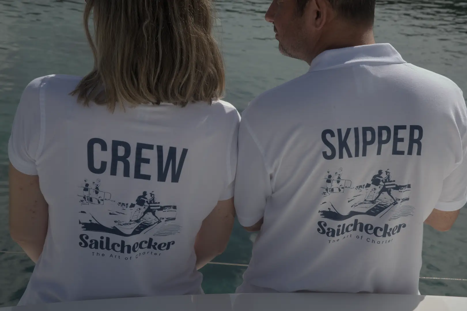 Sailchecker crew stood on a charter yacht sailing in May